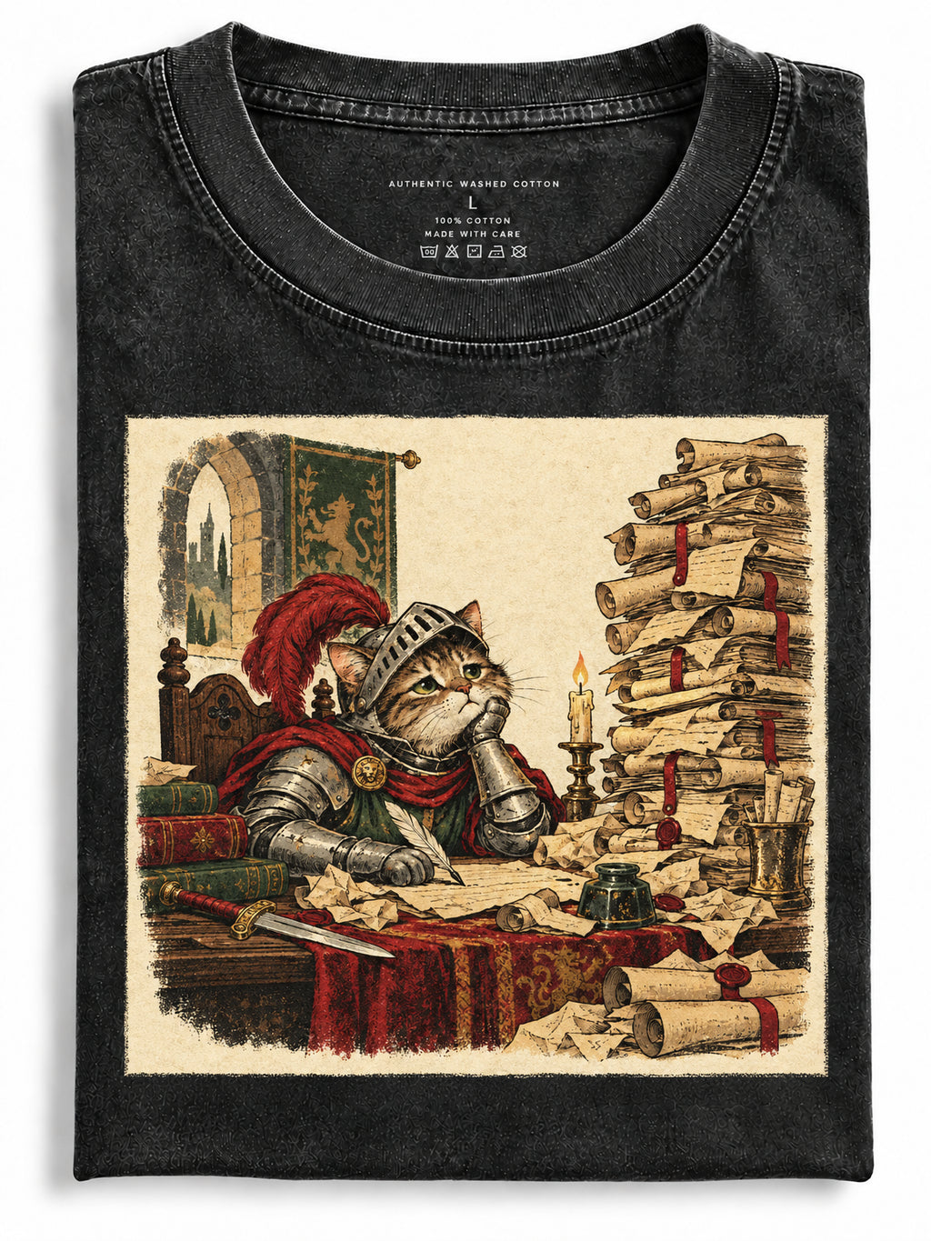 Washed black folded t-shirt featuring an armored knight cat sitting at a desk surrounded by scrolls